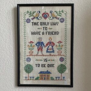 Black Framed Cross-Stitch. Vintage, hand stiched quote done in folk art style.